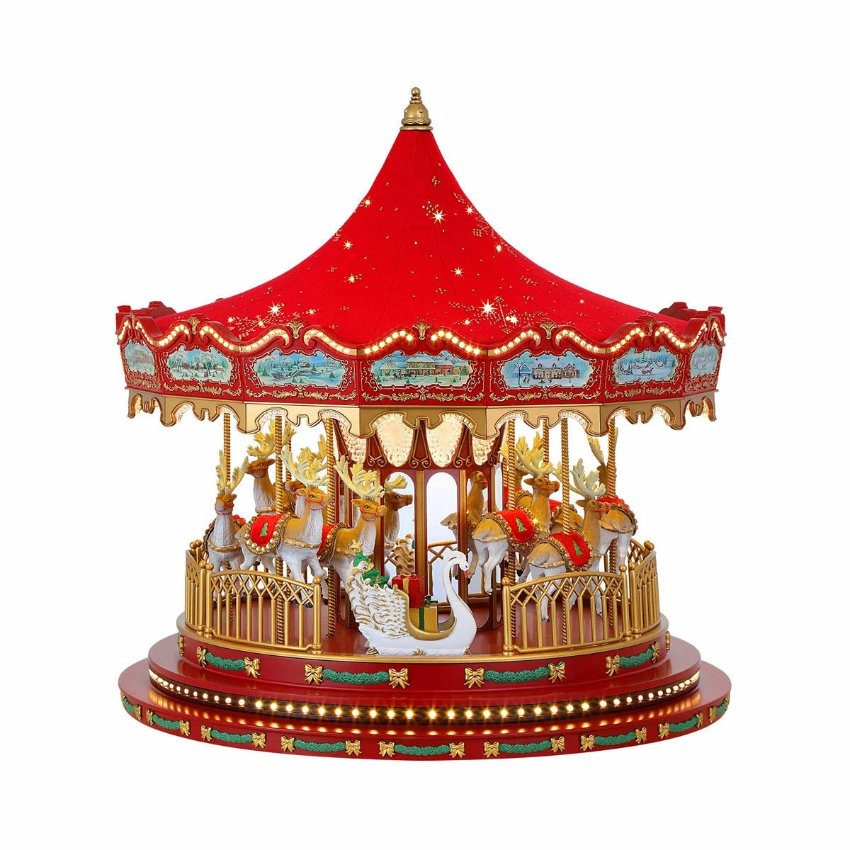 Detailed front view of a red 17 inch vintage carousel holiday centerpieces with glass embellished reindeer, lit up with warm white LED lights on a wooden tabletop.