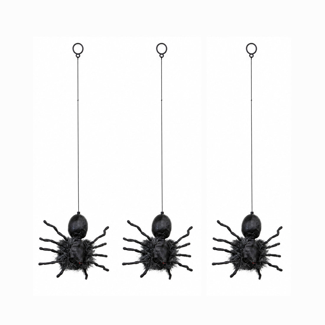Black faux-fur animatronic spider with glowing red eyes hanging from a suspended string against a dark background.