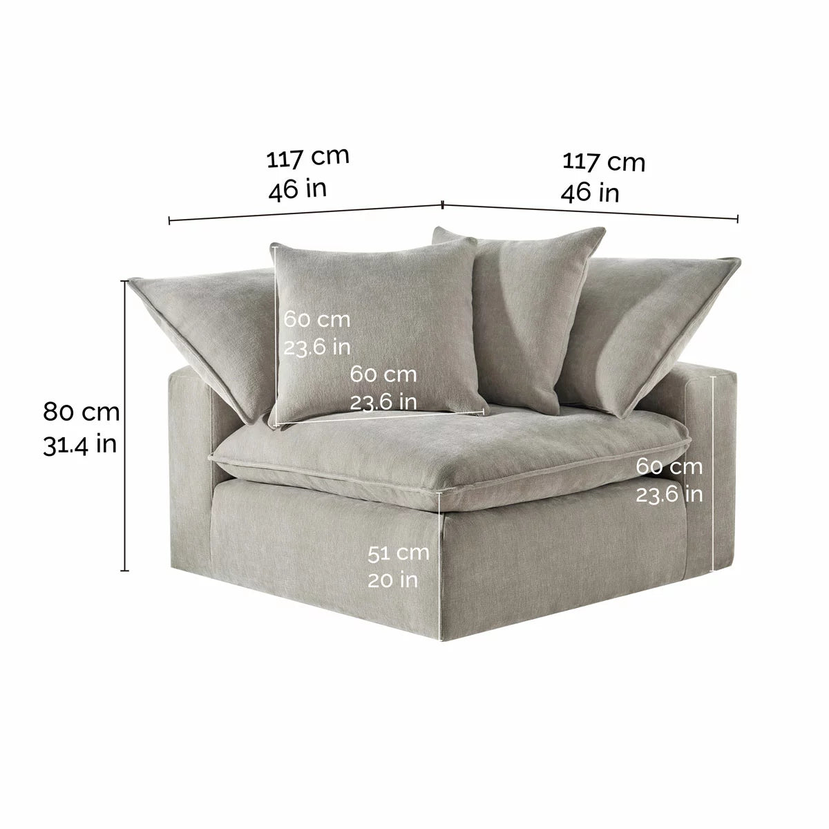 Side angle view of the Aiden & Ivy Sereen modular corner chair upholstered in textured beige fabric with two matching feather pillows resting against the backrest on a clean wooden floor.