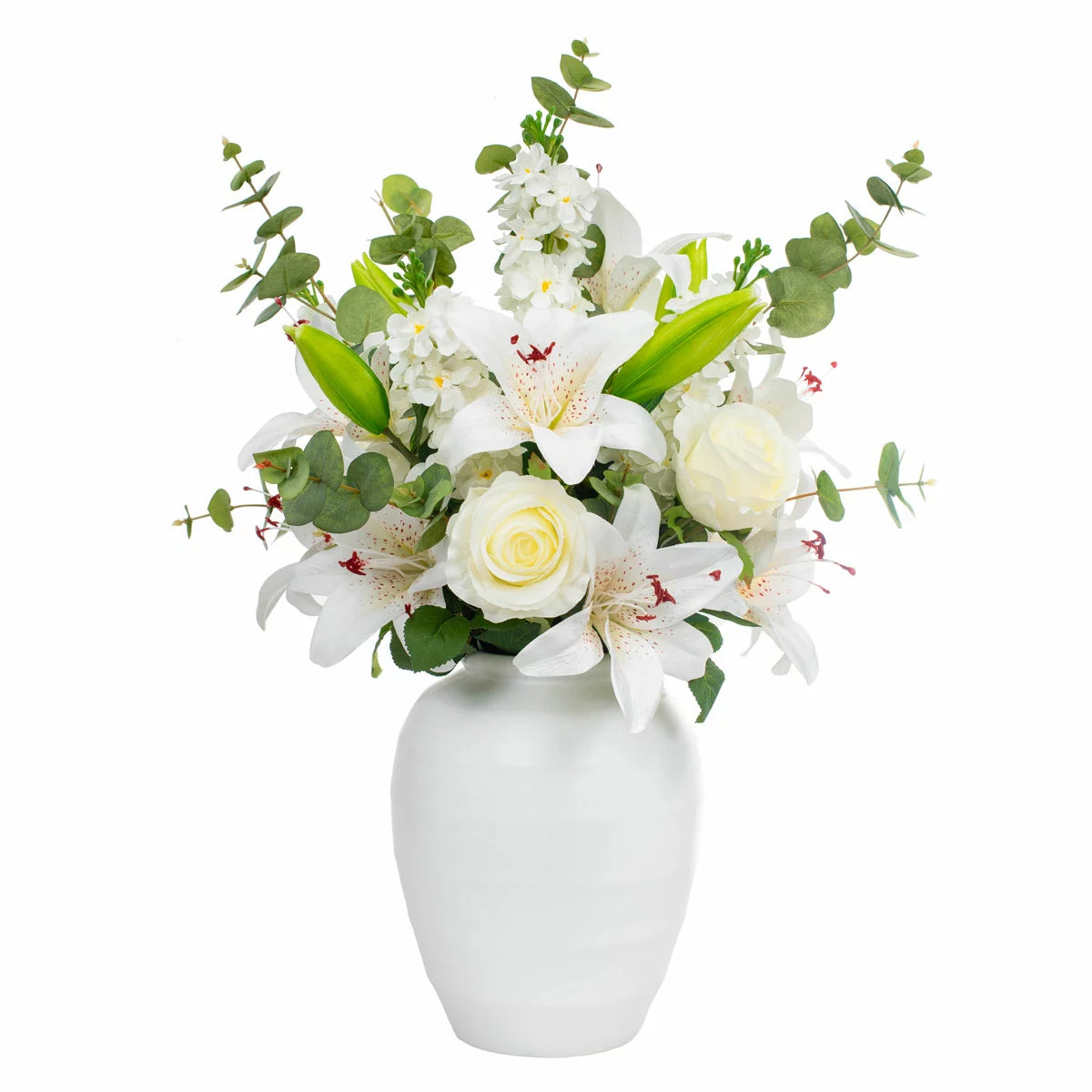 The Artificial Lily & Rose Bouquet in Vase displayed on a flat surface, showcasing vibrant fabric lilies and roses mixed with eucalyptus leaves inside a sleek white bowl.