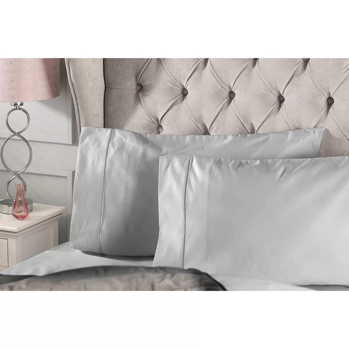 Close-up angle of the Belledorm 1000 thread count pure Egyptian cotton sateen bedding bundle in platinum grey, highlighting its silky, lustrous drape and button-fastened duvet cover on a dressed bed.