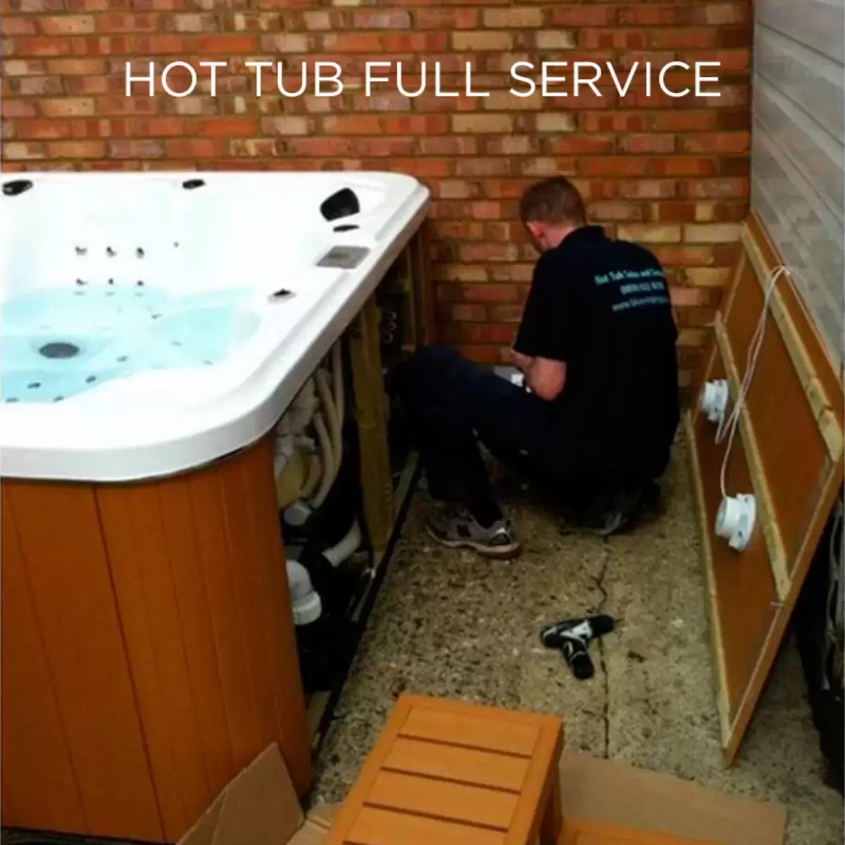 A technician conducting a comprehensive internal inspection and pipework flush on a Blue Whale Spa hot tub during a professional annual service visit.