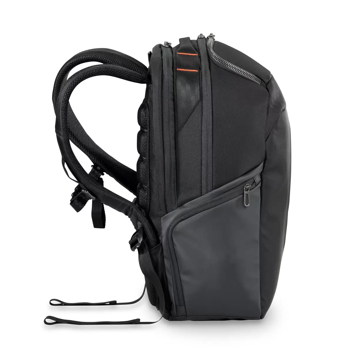 Black Briggs & Riley ZDX Cargo Backpack showcasing top cargo pocket, side zip compartments, and water-resistant PVC base resting on a wooden surface.
