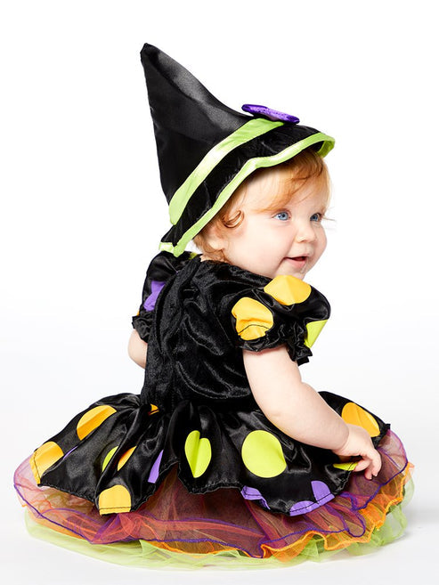 Front view of the Cauldron Cutie baby witch costume featuring a dotty polka-dot dress, colorful tulle skirt, and matching pointed witch hat with a purple bow.