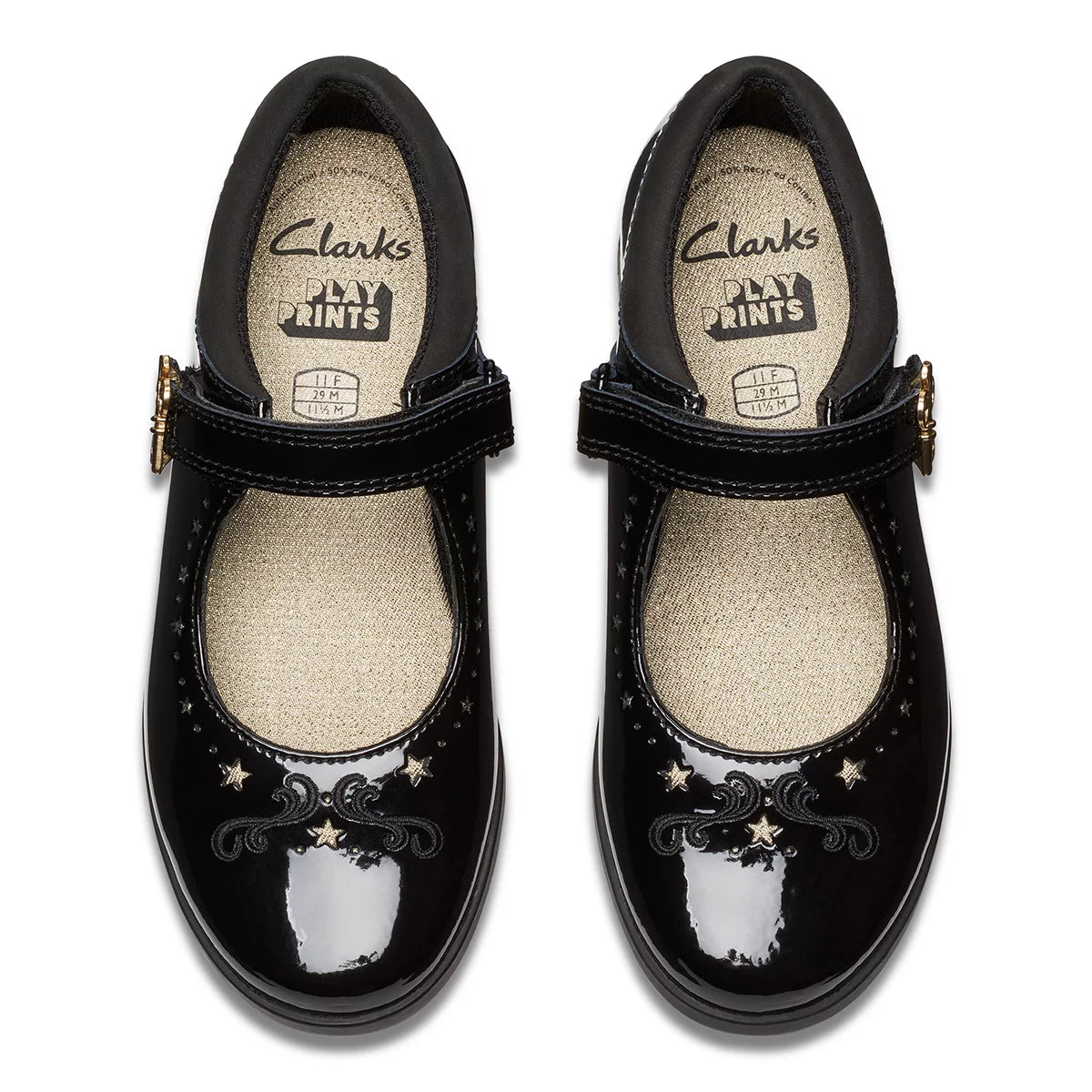 Front angle view of black patent leather Clarks Kids Lock Magic school shoes with riptape strap and key detail design on a neutral studio background.