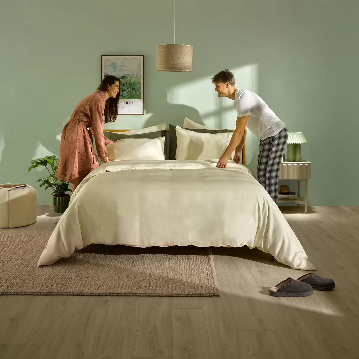 Panda Signature+ cream bamboo lyocell bedding set draped on a mattress showing silky satin texture, fitted sheet, duvet cover, and pillowcases.