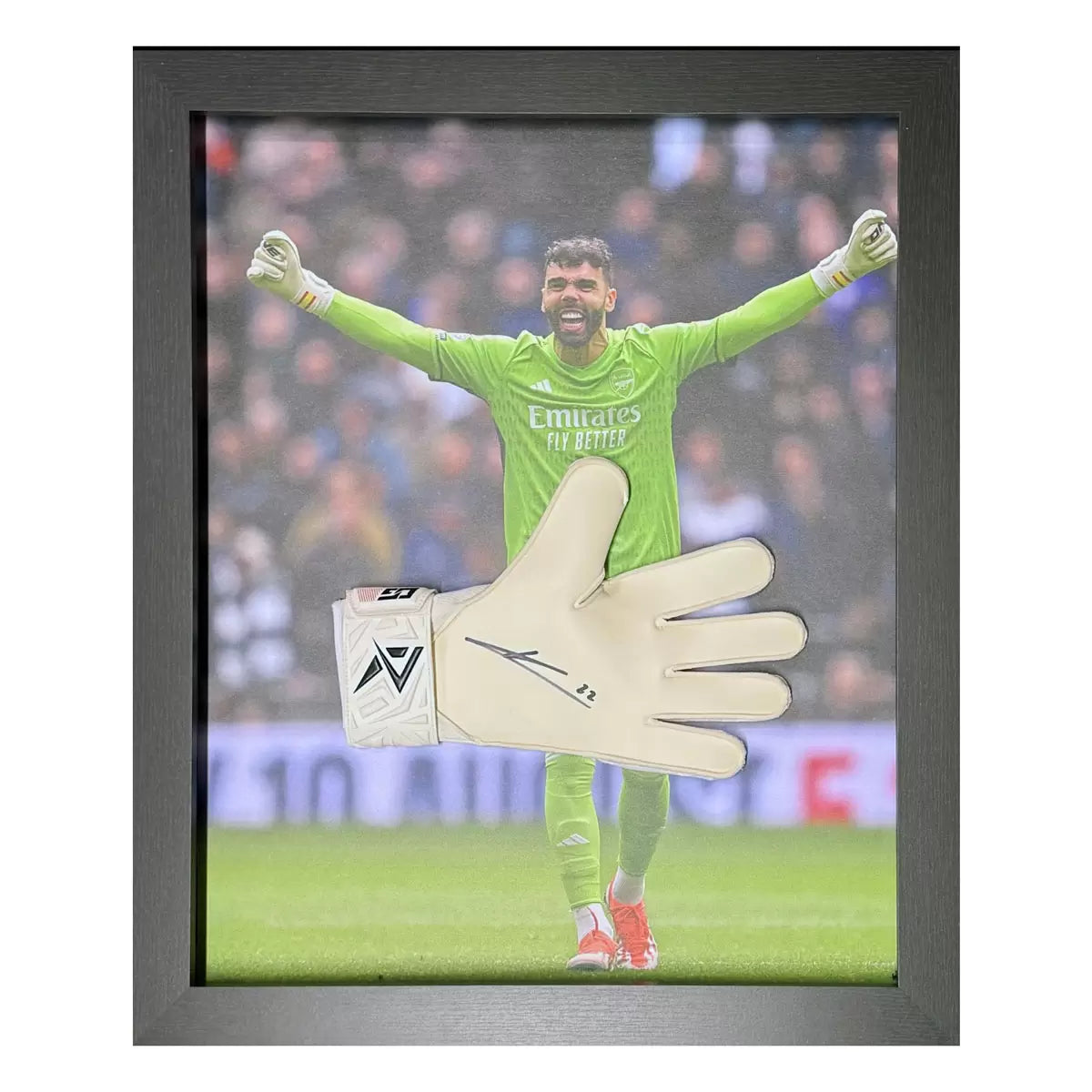 A professionally framed, match-grade Arsenal goalkeeper glove signed by David Raya, displayed against a dark backdrop to emphasize texture and detail.