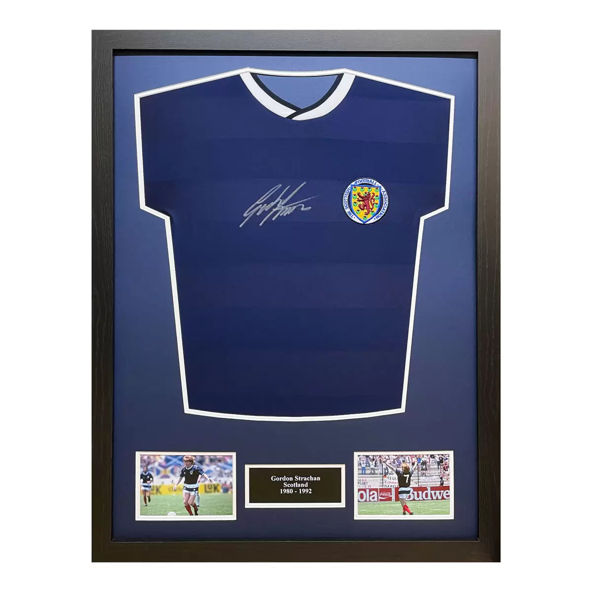 A professionally framed retro Scotland football shirt signed by Gordon Strachan, captured in a front-facing studio shot to emphasize the signature and framing quality.