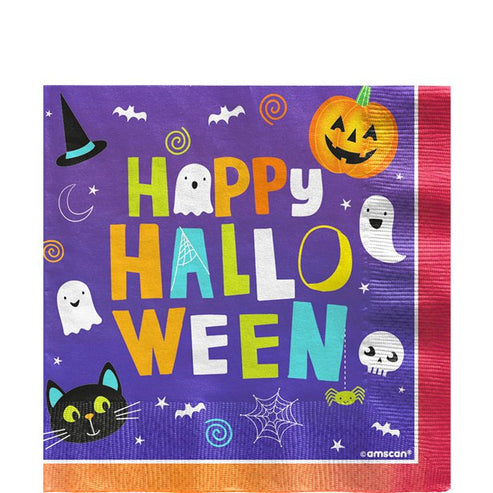 Unfolded square Halloween Friends paper napkin displaying colorful spooky characters laid flat on a rustic wooden party table.