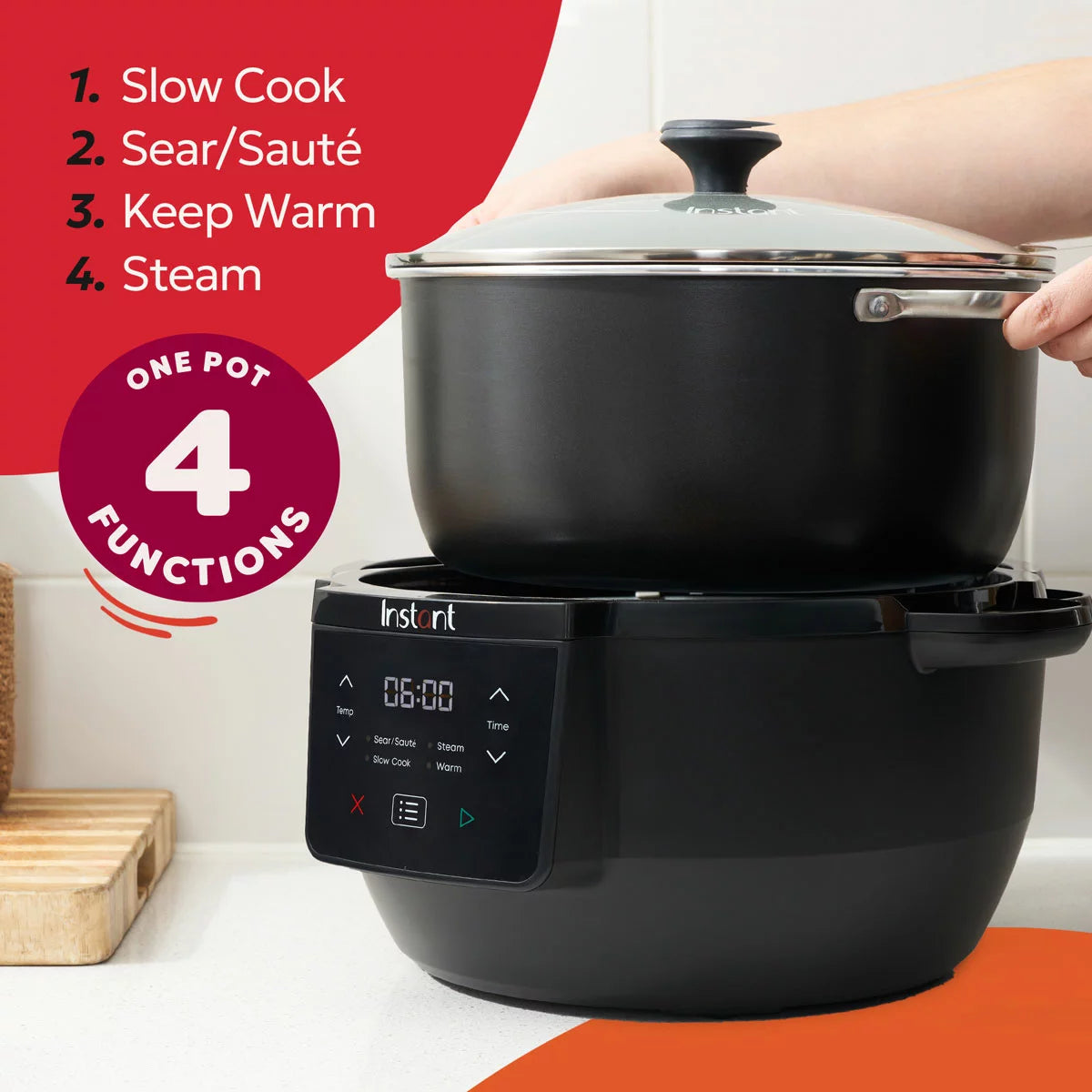 A black Instant Pot Superior 7.1L slow cooker sitting on a wooden kitchen surface with its glass lid resting neatly on top.