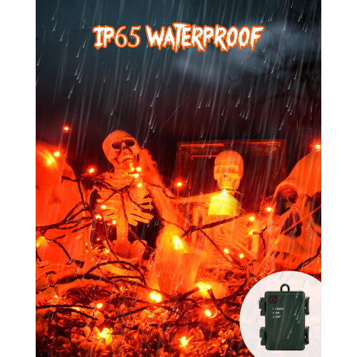 A 3-meter strand of 30 orange LED fairy lights glowing warmly on a green wire wrapped around an outdoor garden tree branch.