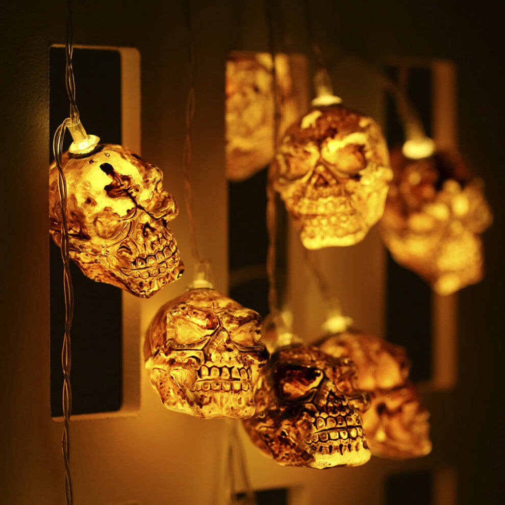 A 2-pack of 9.8ft Kyoffiie Halloween string lights featuring 20 LED bulbs glowing softly along a festive porch railing.