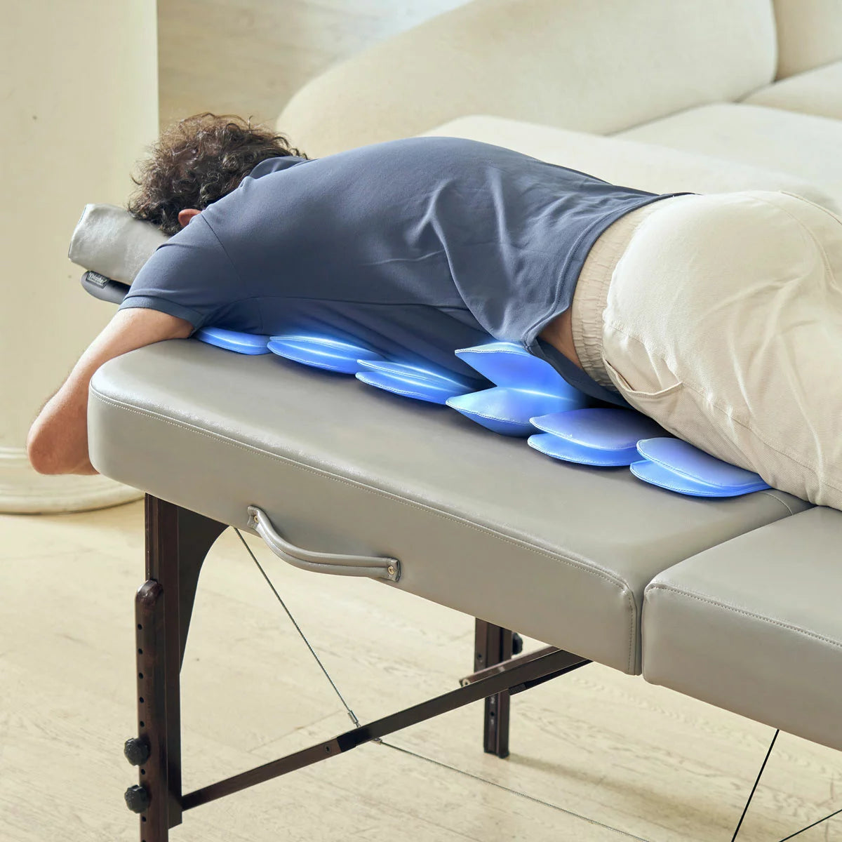 The Master Massage Bristol Airwave table set up in a clean, professional studio with visible airbag control panels and the included deluxe carry case positioned nearby.
