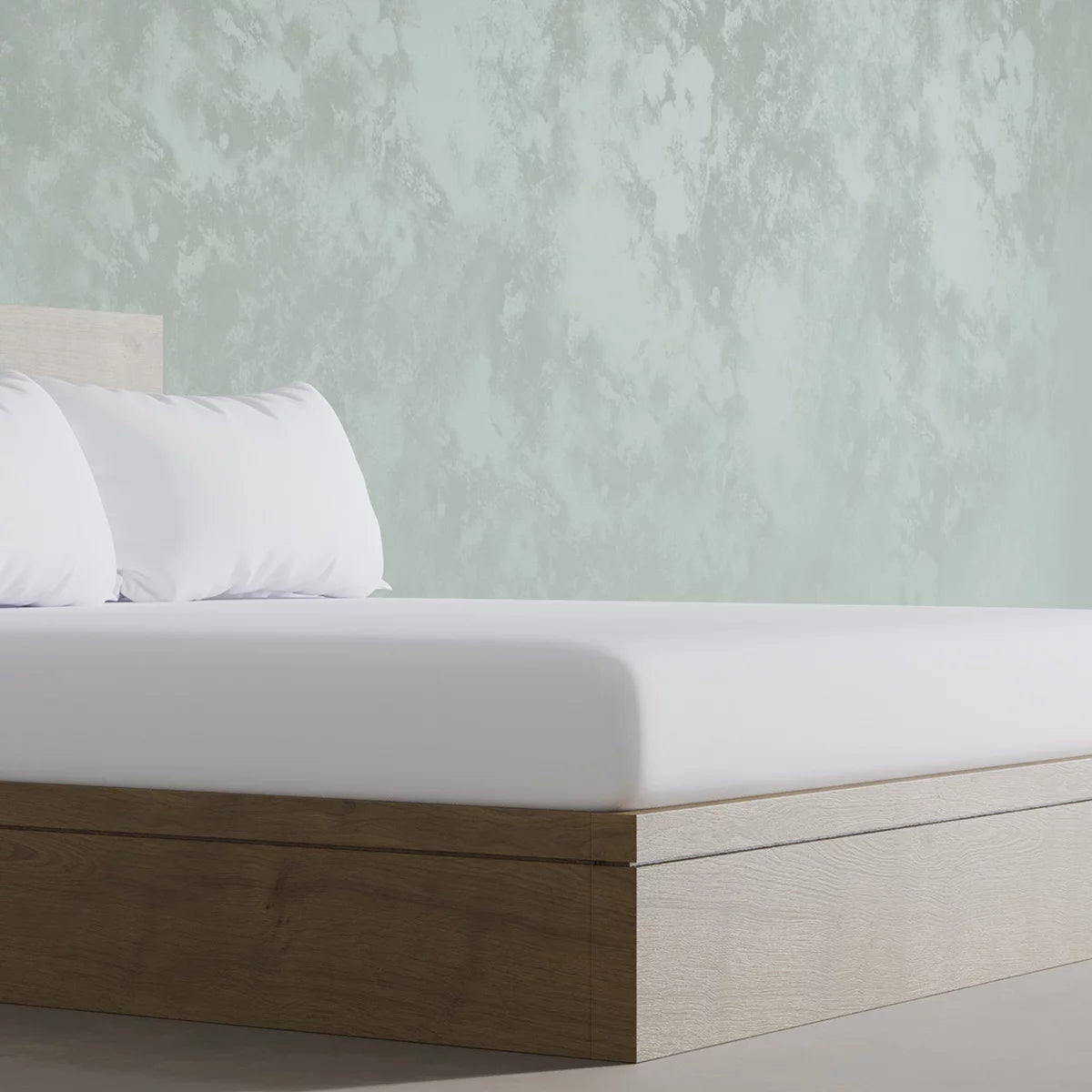 Crisp white Panda 100 percent organic bamboo fitted sheet securely pulled tight over a deep mattress corner showing smooth texture.