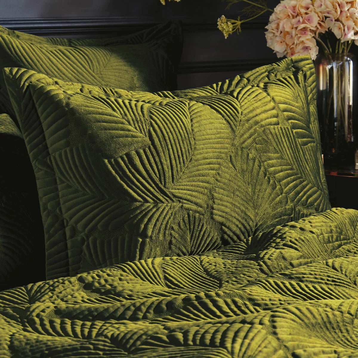 Earthy moss green Paoletti velvet duvet cover featuring intricate palm embroidery with matching Oxford pillowcases styled on a modern bed.