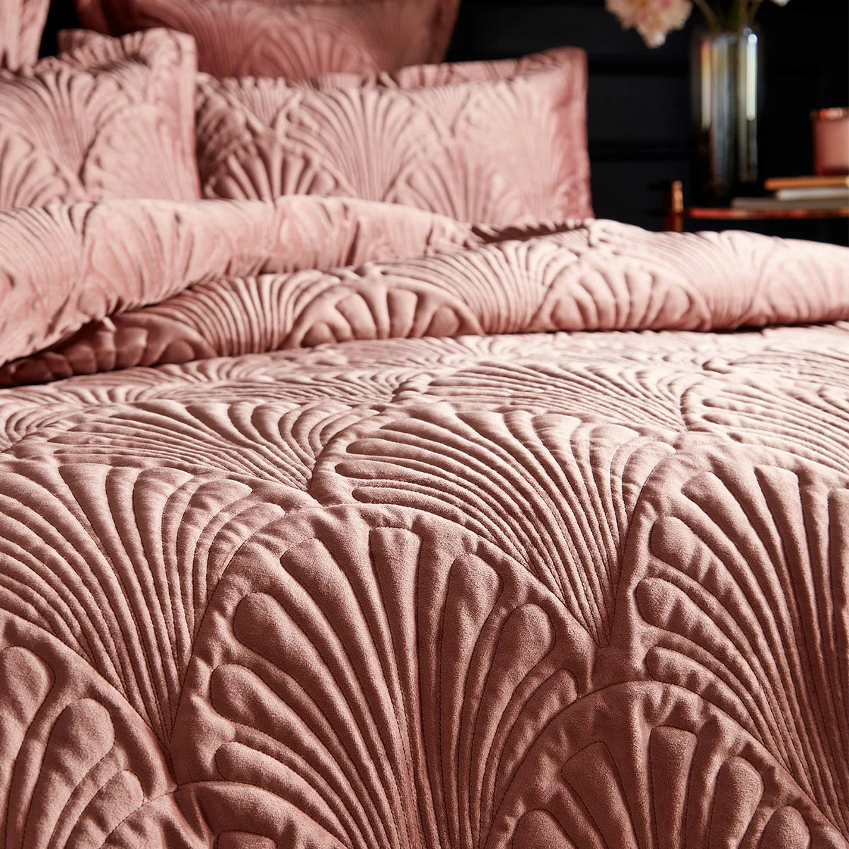 Soft blush pink Paoletti velvet duvet cover featuring intricate palm embroidery with matching Oxford pillowcases on a modern bed setup.