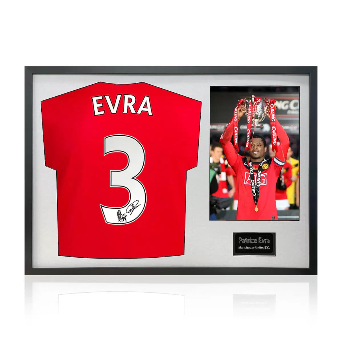 A professionally framed Manchester United jersey signed by Patrice Evra, displayed alongside an action photograph within a black mount and high-clarity glass frame.