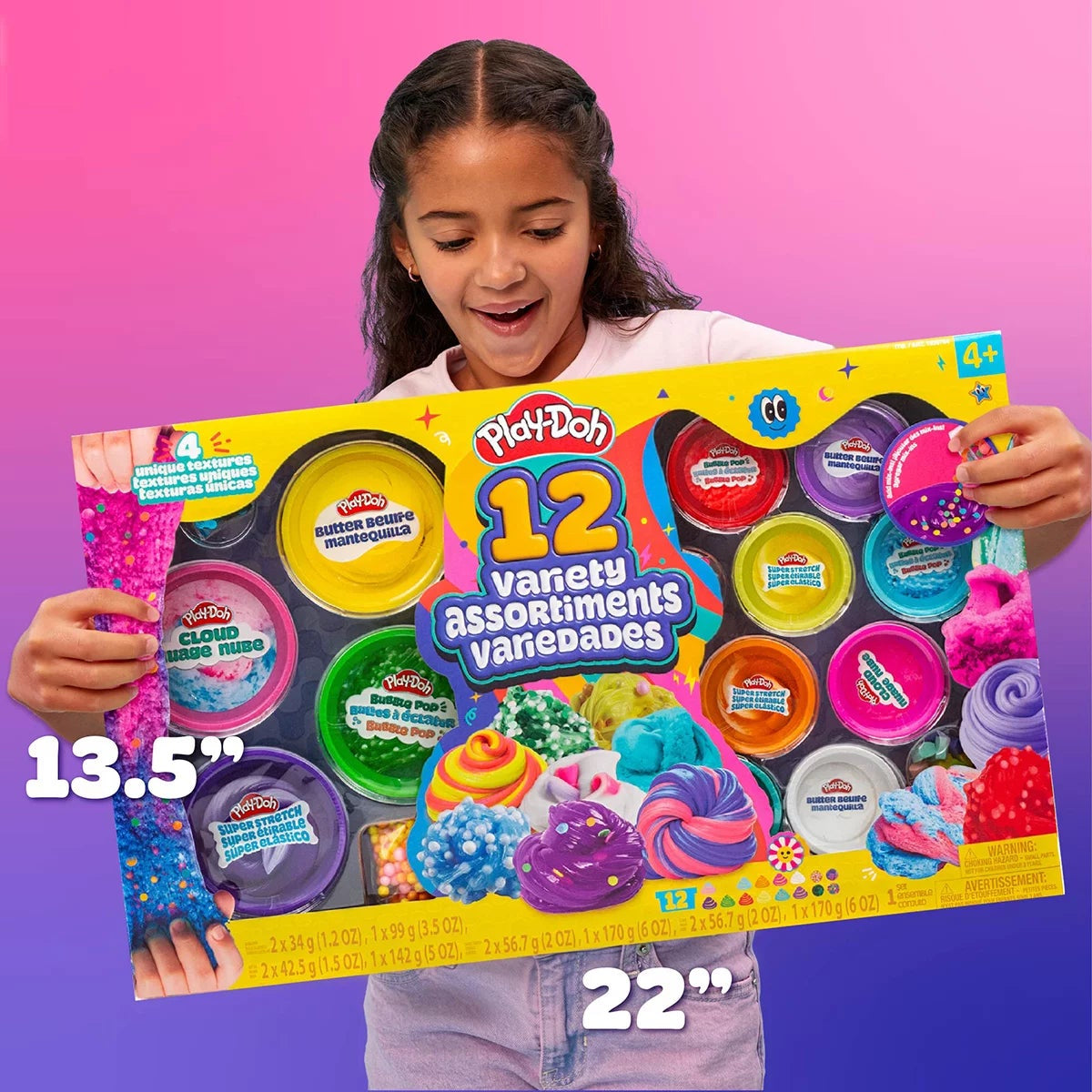 Top view of 12 colorful Play-Doh slime and sand tubs with foam marshmallow mix-ins and molding accessories arranged on a white table.