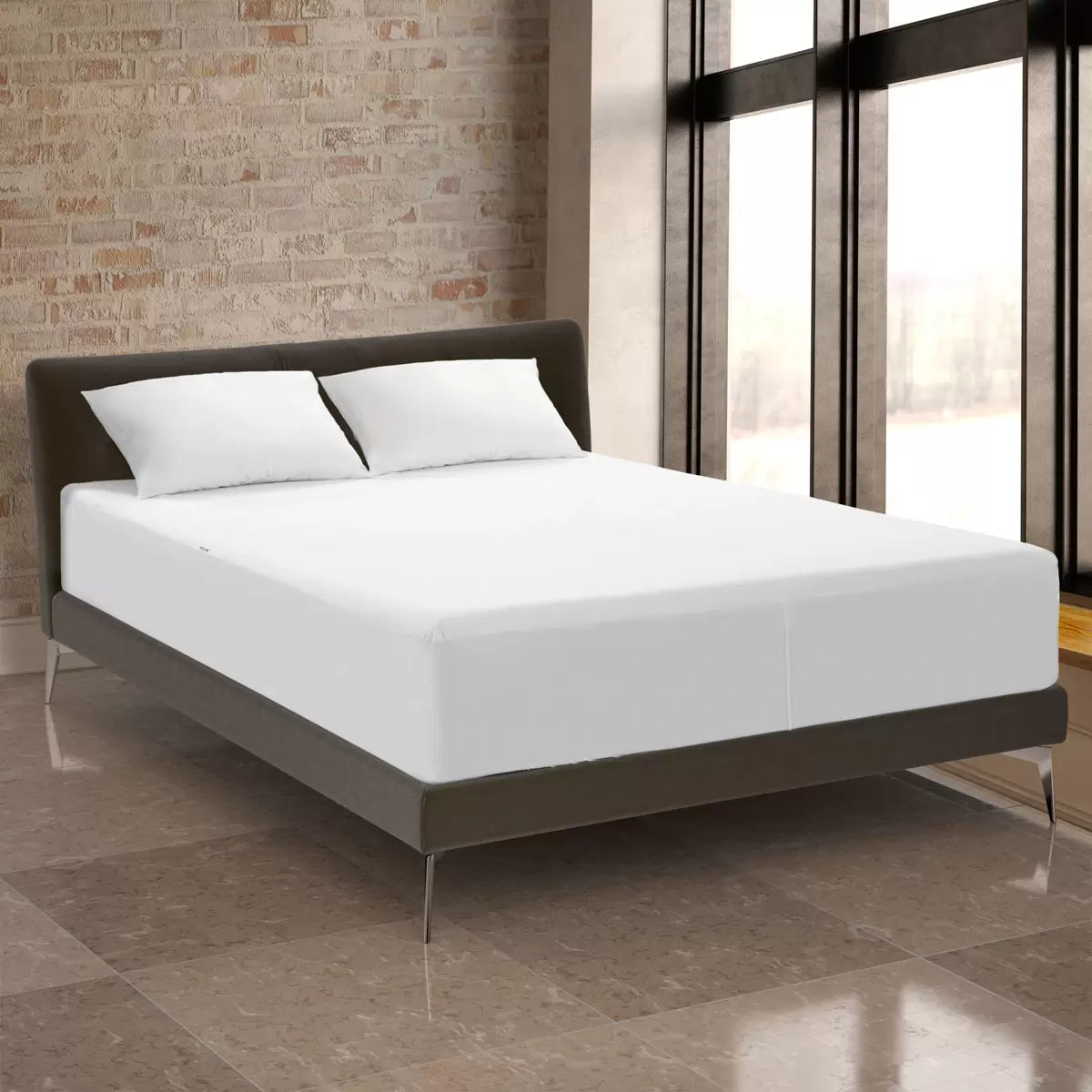 White Protect-A-Bed Tencel Cool Mattress Protector fitted smoothly over a thick mattress in a bright bedroom setting.