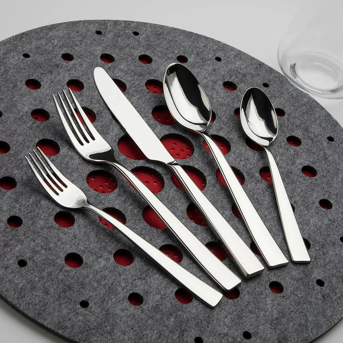 Resto 60-piece stainless steel cutlery set with mirror-polished finish displayed for modern dining table use