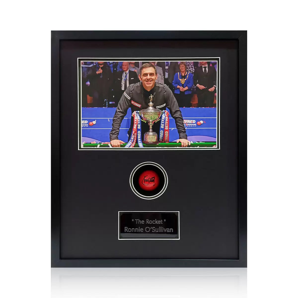 A signed red snooker ball by Ronnie O'Sullivan, mounted inside a polished real wood display frame against a professional background.