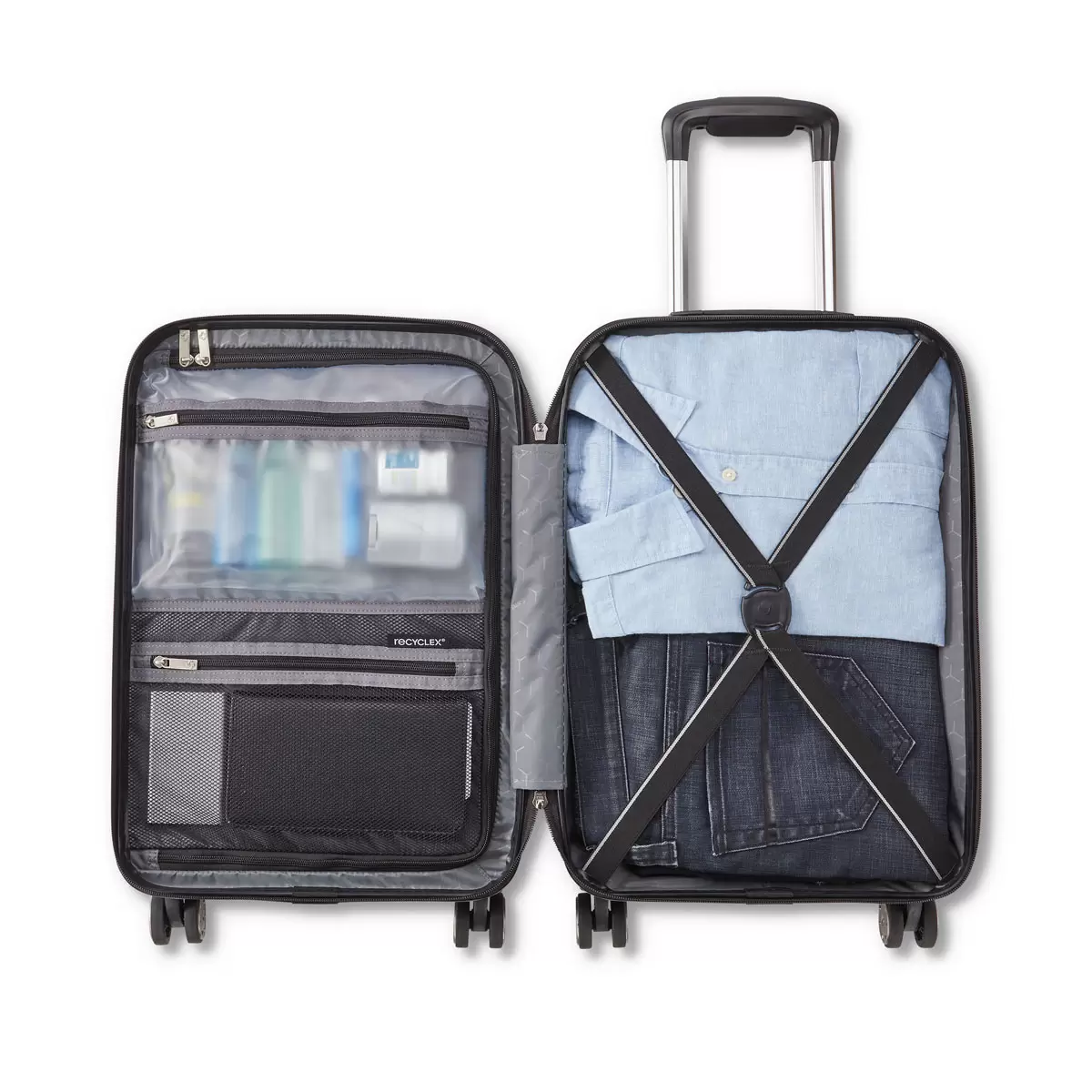 Samsonite Amplitude large hardside case in metallic finish standing upright in a sleek airport terminal corridor.