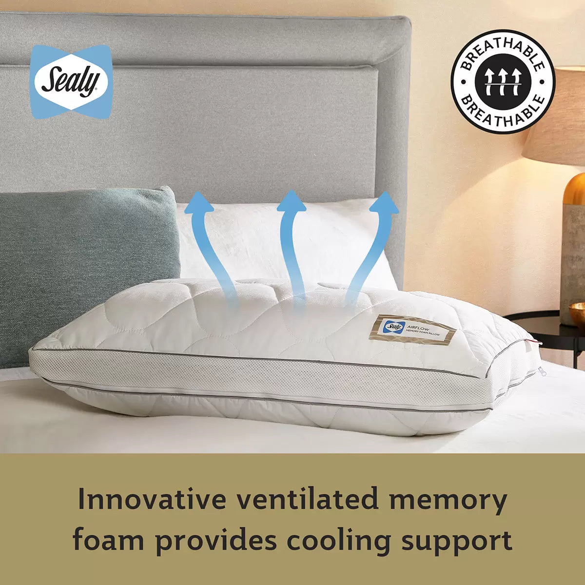 White Sealy Memory Airflow Pillow showing the quilted cotton surface and breathable grey air mesh sidewall details on a modern bed setup.