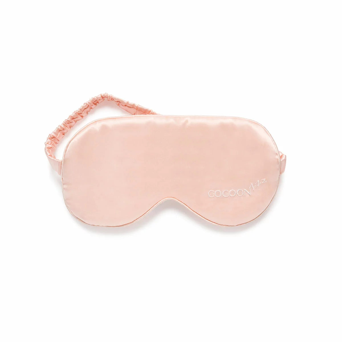 Cocoonzzz 100 percent Mulberry silk pillowcase and matching eyemask displayed in an elegant gift box on a white duvet.