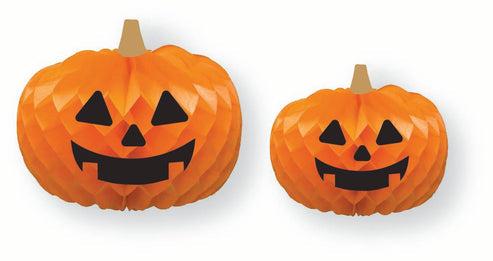 Three orange paper honeycomb pumpkin decorations wearing whimsical black glasses displayed on a rustic wooden tabletop against a dark autumn backdrop.