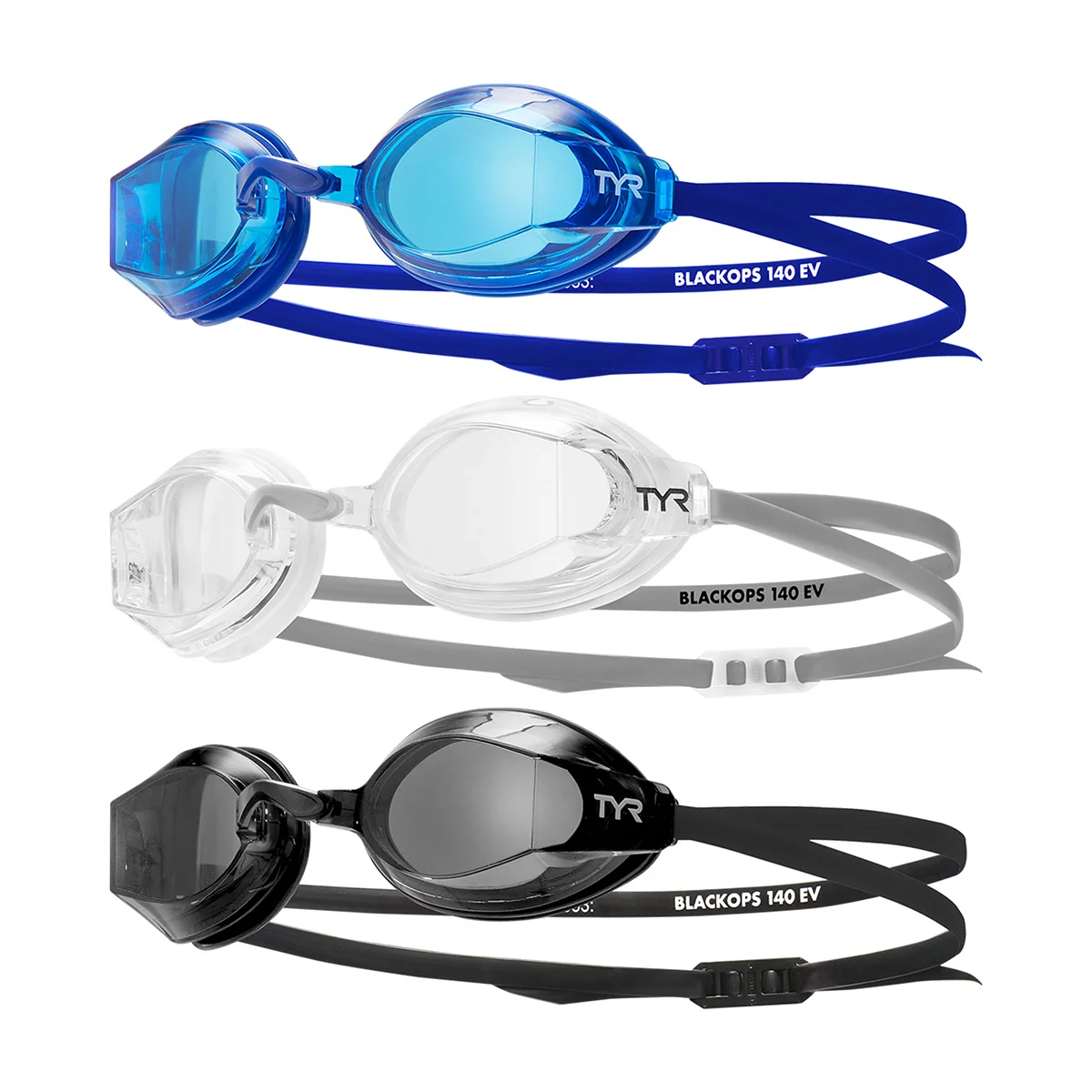 Three pairs of low-profile TYR adult swim goggles with clear anti-fog lenses and black silicone straps arranged neatly on a pool deck.