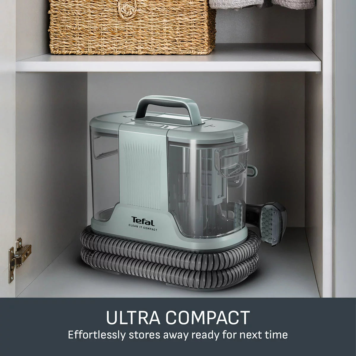 The Tefal IZ3020GO Clean It Compact Spot Cleaner in Eucalyptus, showcasing its compact body, attached hose, and cleaning head accessories.