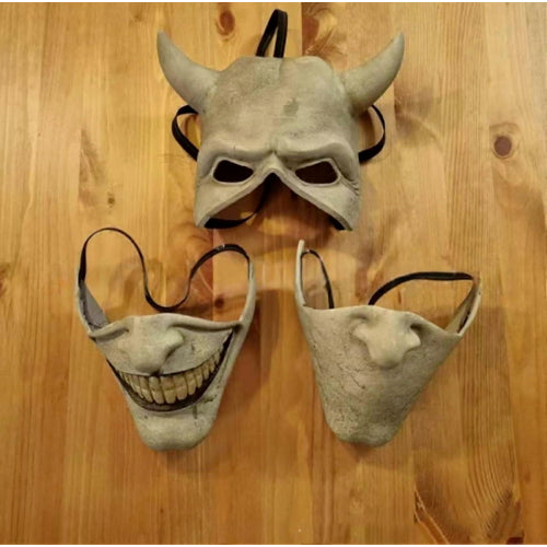 Front view of the light grey Graber horror film cosplay mask showing realistic latex texturing, dark eye cutouts, and elastic headband.