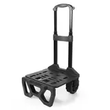 Side angle view of the dark grey Titan 22.5L 60 can cooler mounted securely onto its folded out black all-terrain cart with oversized rugged wheels, set on a gravel path.