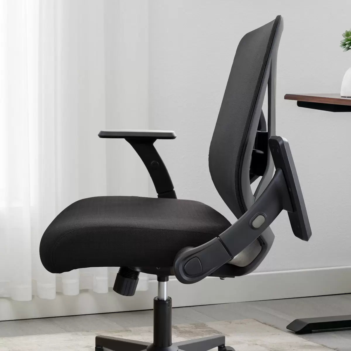 True Innovations mesh office chair with breathable mesh back, flip-up arms, adjustable height, and ergonomic office seating design.