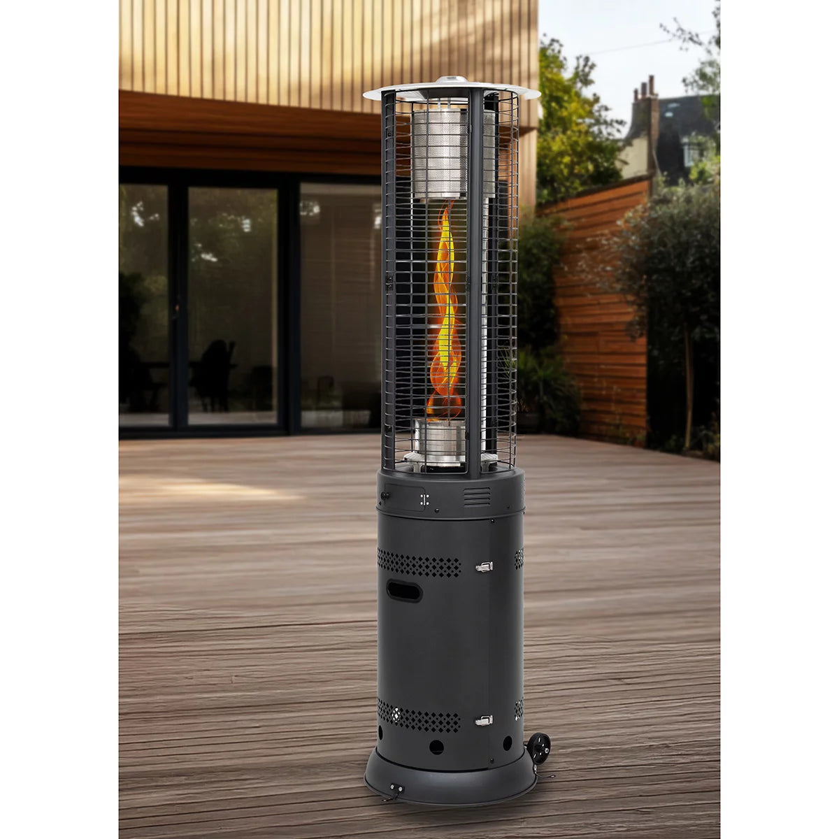 Well Traveled Cyclone Flame Gas Patio Heater with a bright, spiralling flame inside a glass tube on a modern patio.