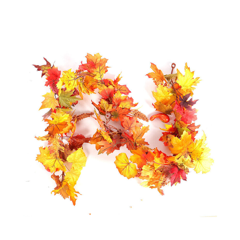 A 1.8m LED light-up autumn pumpkin and maple leaf vine garland glowing warmly draped across a wooden front door.