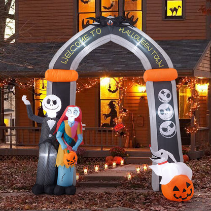 Front view of a 10ft tall inflatable Halloween archway with Jack Skellington and Sally illuminated by internal LEDs on a lawn.