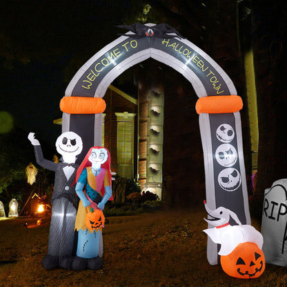 Front view of a 10ft tall inflatable Halloween archway with Jack Skellington and Sally illuminated by internal LEDs on a lawn.