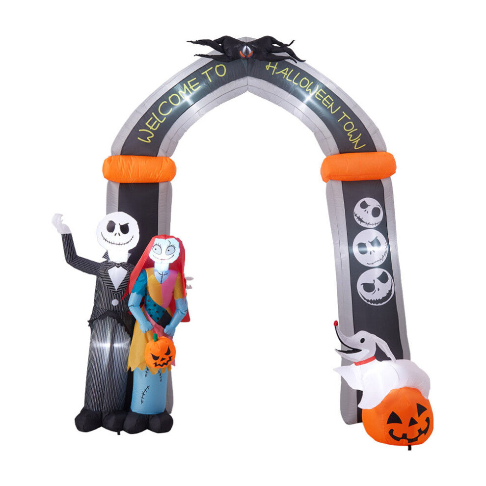 Front view of a 10ft tall inflatable Halloween archway with Jack Skellington and Sally illuminated by internal LEDs on a lawn.