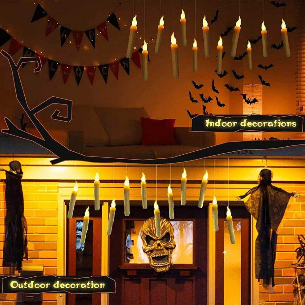 A set of 12 glowing LED floating taper candles suspended in the air with warm yellow flickering flames against a dark background.