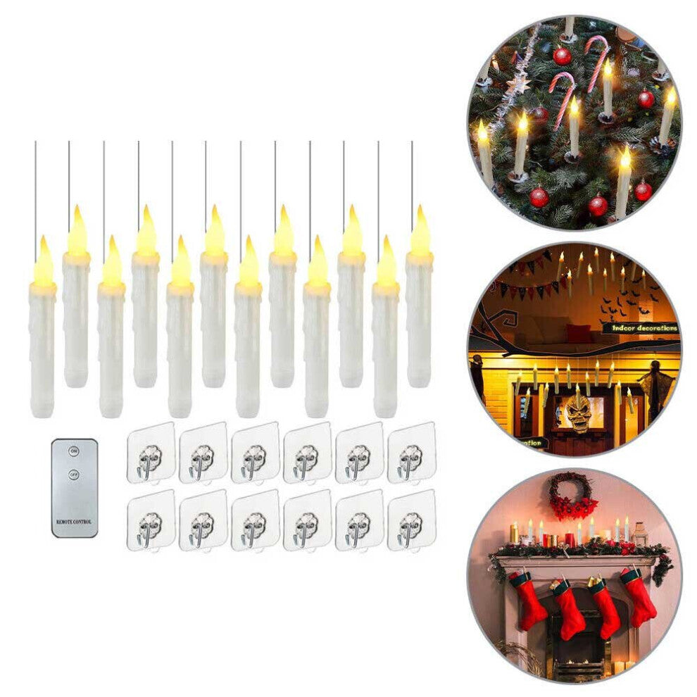 A set of 12 glowing LED floating taper candles suspended in the air with warm yellow flickering flames against a dark background.