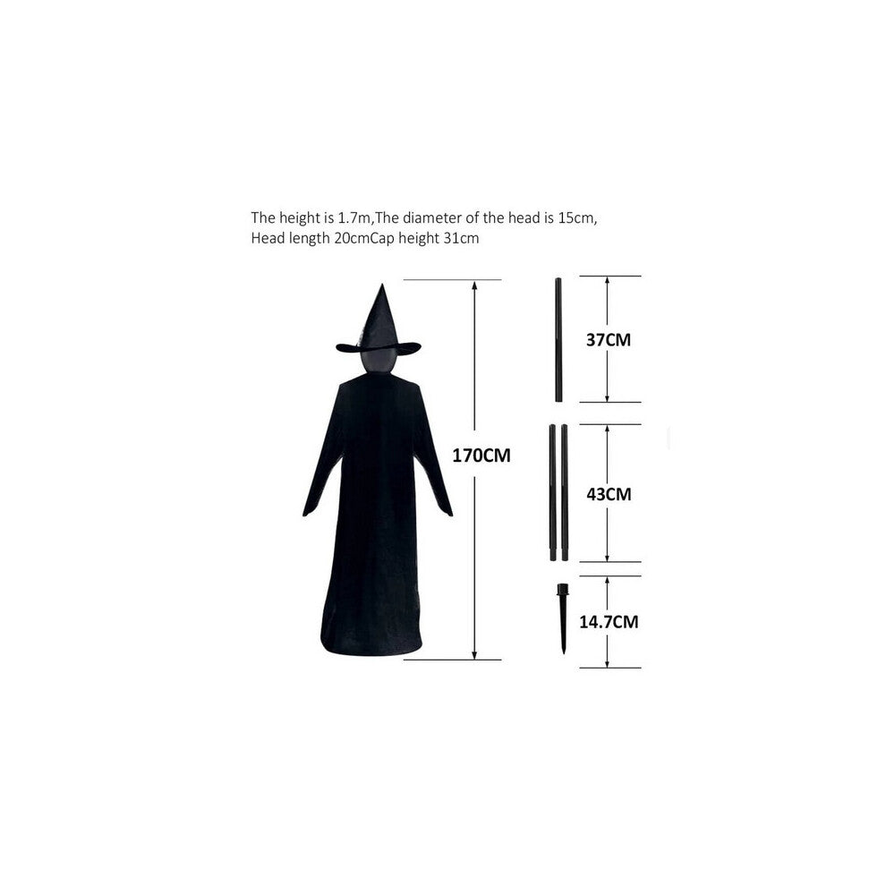 Front view of three 170cm life-size faceless witches in black robes holding hands on a dark lawn with glowing heads flickering in the dark.
