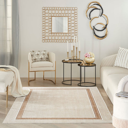 Nourison Glitz cream border area rug, low pile polyester with shimmer finish