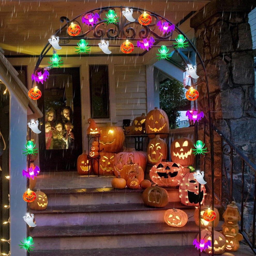 A 20ft string of 40 multi-shaped Halloween LED lights featuring pumpkins, bats, spiders, and ghosts glowing along an indoor mantelpiece.