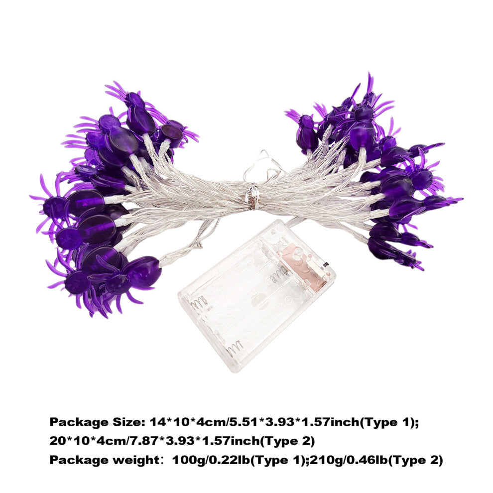 A 20ft string of 40 purple spider-shaped LED lights glowing against an outdoor garden fence at night.