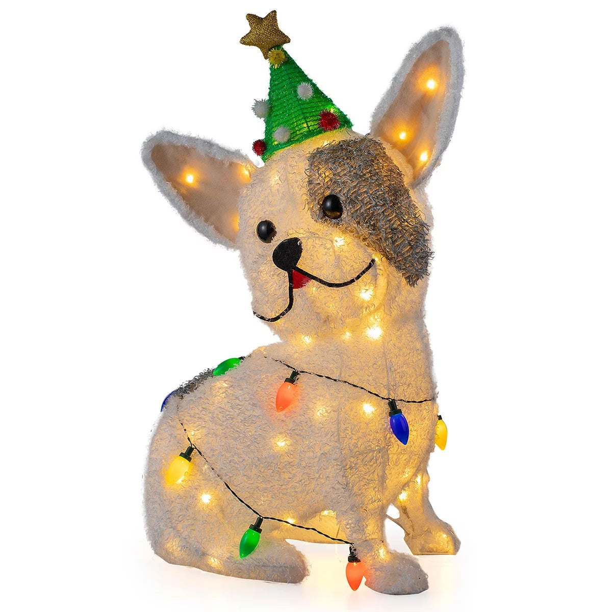 Three illuminated outdoor LED Christmas dog figures standing on a green lawn wearing festive scarves and headbands at twilight.
