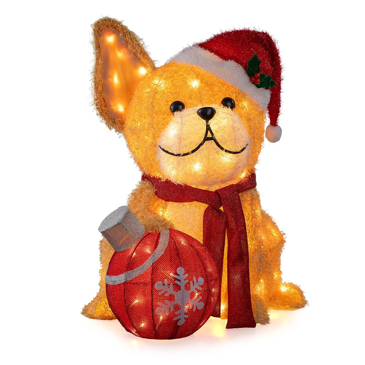 Three illuminated outdoor LED Christmas dog figures standing on a green lawn wearing festive scarves and headbands at twilight.