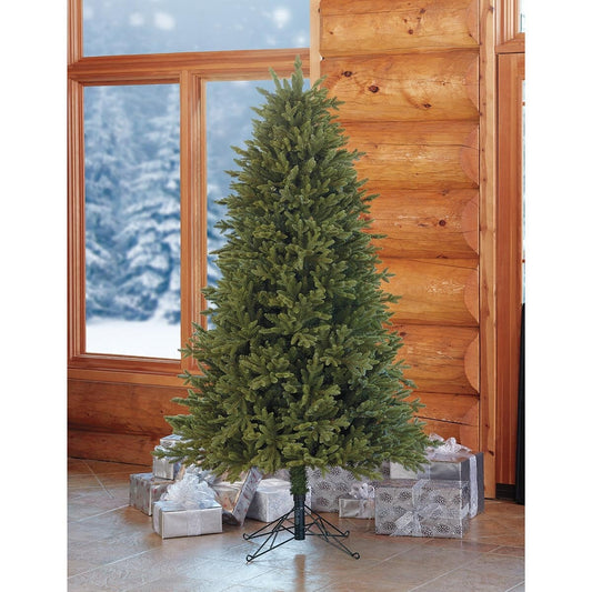 6.5ft unlit Aspen artificial Christmas tree by a window with wrapped presents underneath