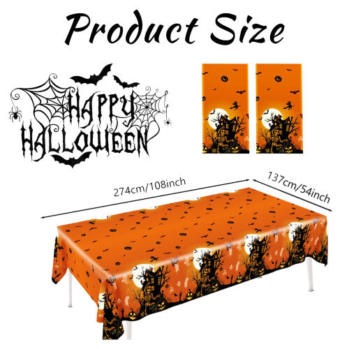 Flat lay of two orange rectangular plastic Halloween tablecloths featuring black prints of spooky castles, bats, spiders, and pumpkins spread over a long dinner table.