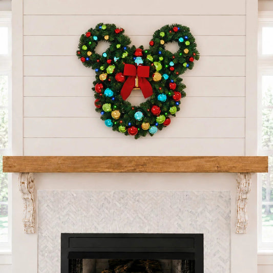 30 inch pre-lit artificial Christmas wreath shaped like Mickey Mouse head decorated with red bow, colorful ornaments, and glowing LED lights.